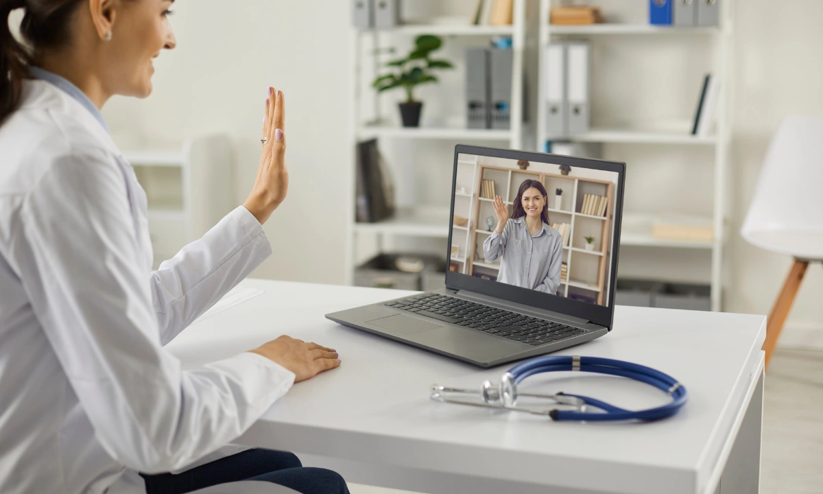 Doctor conducting an interprofessional internet consultation through a secure video call to collaborate on patient care.